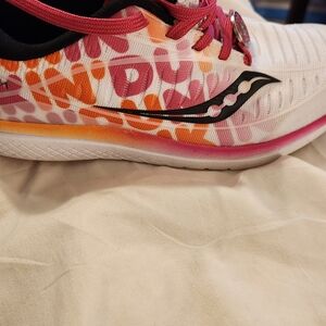 Kids tennis shoes that has dunkin donut on them. Made by Saucony